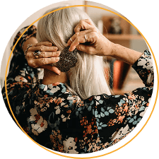 Elderly woman applying a hairpin