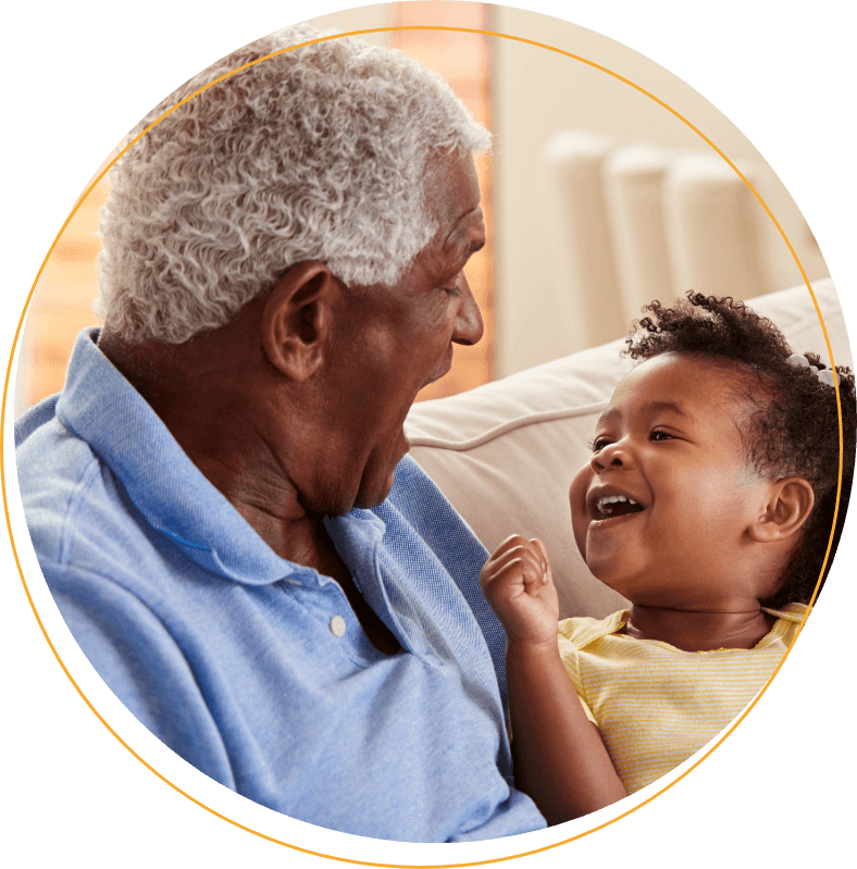 Grandfather and grandchild laughing together