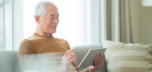 Elderly man using a tablet